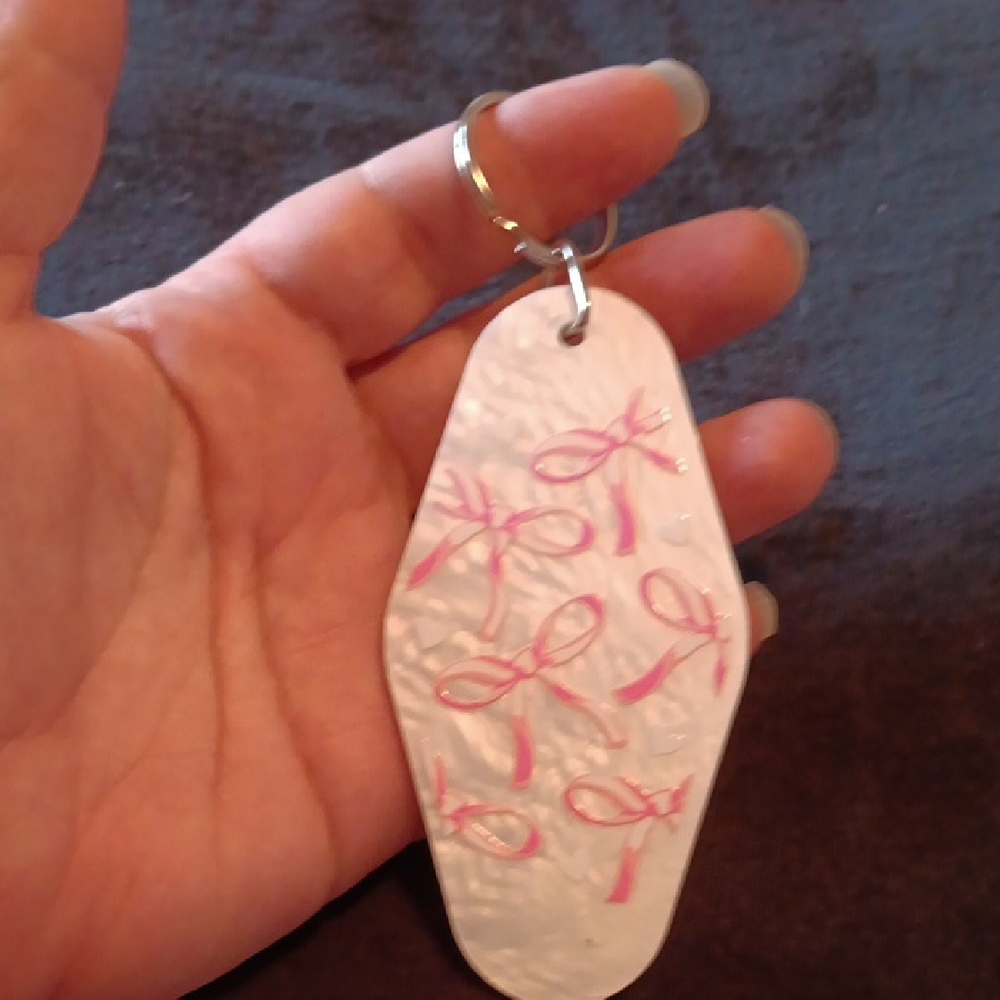 White Keychain with Pink Ribbon Design